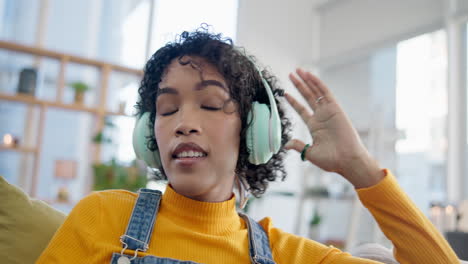 Music,-relax-and-dance-with-woman-on-sofa