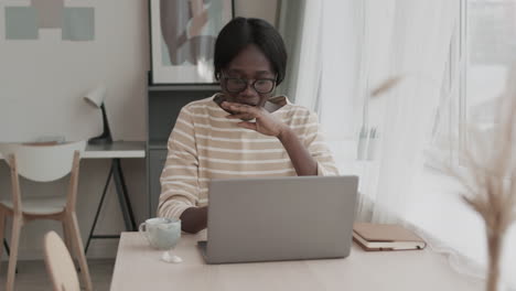 sleepy young woman working from home