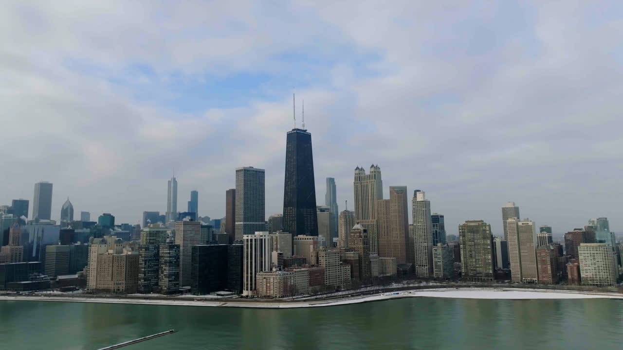 Aerial view around the Streeterville skyline, partly sunny day in Chicago, USA - orbit, drone shot