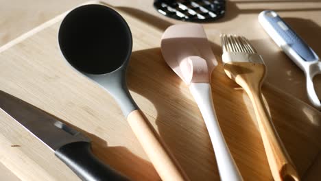 kitchen utensils on a cutting board