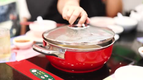 preparing hotpot meal with friends in bangkok