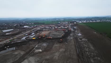 Slow-establishing-shot-of-a-building-site-progressing-with-housing-plots