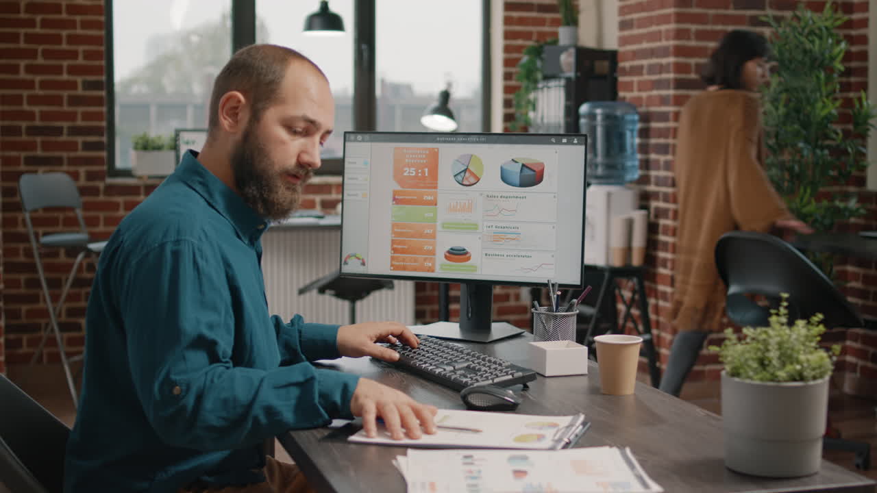 Office Workplace with Employees Analyzing Data