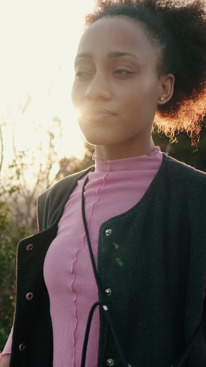 Woman Dances While Walking at Sunset