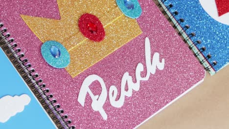 notebook front cover with pink and crown design, handmade notebook close up