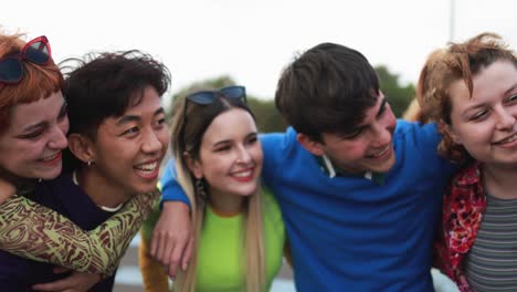 young diverse people having fun outdoor laughing together