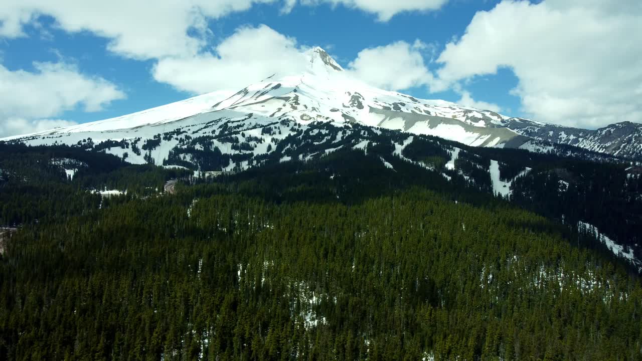 US, Oregon, Mt Hood, Bennett Pass, 2025-04-22 - Drone view of Mt Hood outside of Portland. On a spring day, with some clouds, viewed from the Southeast at Mt Hood Meadows