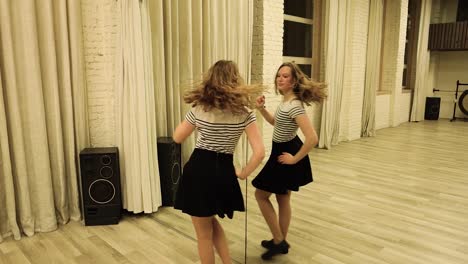 Slow-motion-talented-teenage-female-dancer-dancing-in-front-of-a-mirror