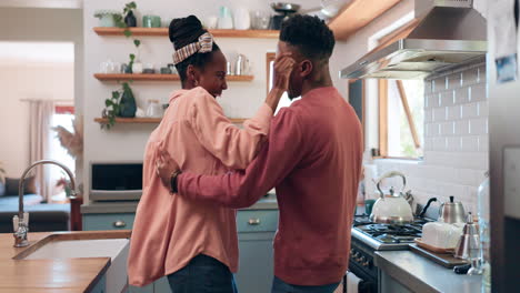 Dance,-love-and-couple-in-kitchen-laughing