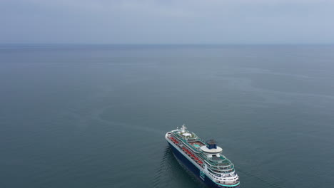 cruise ship sailing in the mediterranean sea cloudy day aerial drone shot