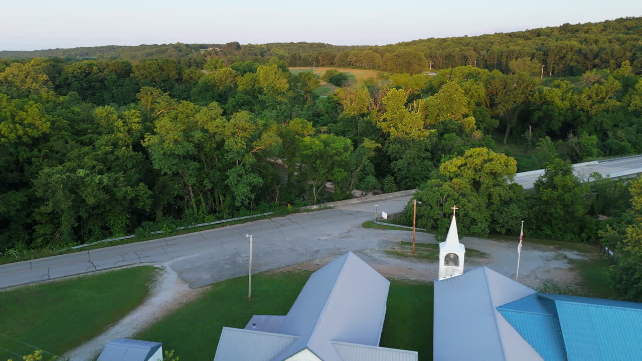 Drone Flyover Traditional Rural American Church in a Forested Countryside