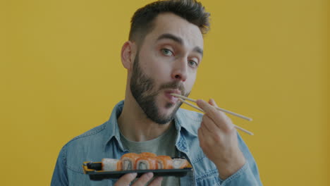 man eating sushi