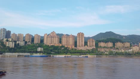 highrise residential and commercial buildings on the shore of yangtze river in chongqing city