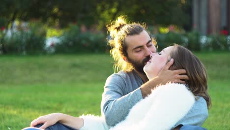 couple kissing in a park