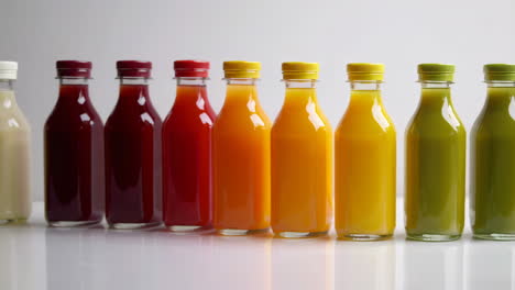 colorful bottled juices and smoothies in a gradient arrangement