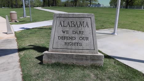 stone marker at an alabama rest area that reads alabama we dare defend our rights and stable video