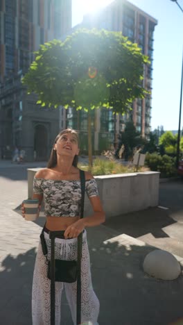 woman with suitcase in city