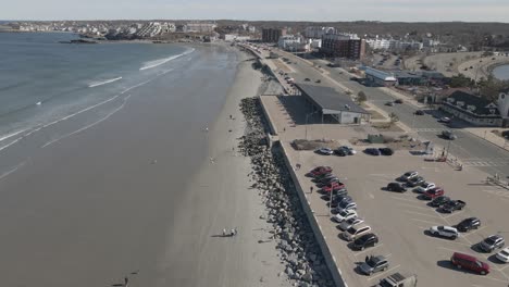 aerial slow motion of nantasket beach, hull, ma showing bandstand pavilion on the right of clip