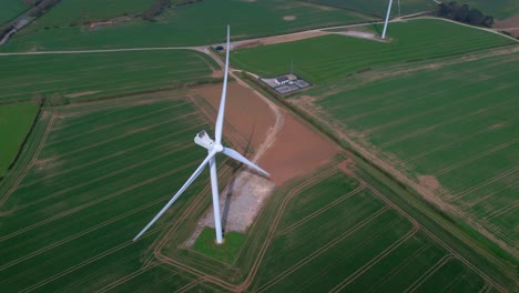 overlooking lissett airfield rotating wind turbine farm on agricultural farmland aerial view yorkshire countryside