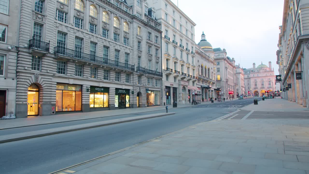 Lockdown in London, slow motion gimbal walk through empty Regent Street St. James's Street during the Coronavirus pandemic 2020, in morning sunrise light.
