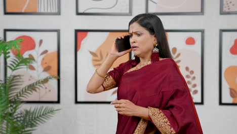 Scared-Indian-woman-talking-on-phone