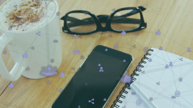 Animation of icons connected with lines over spectacles, cellphone, notepad and cappuccino on table