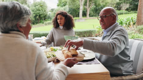 family enjoying a meal together on the patio