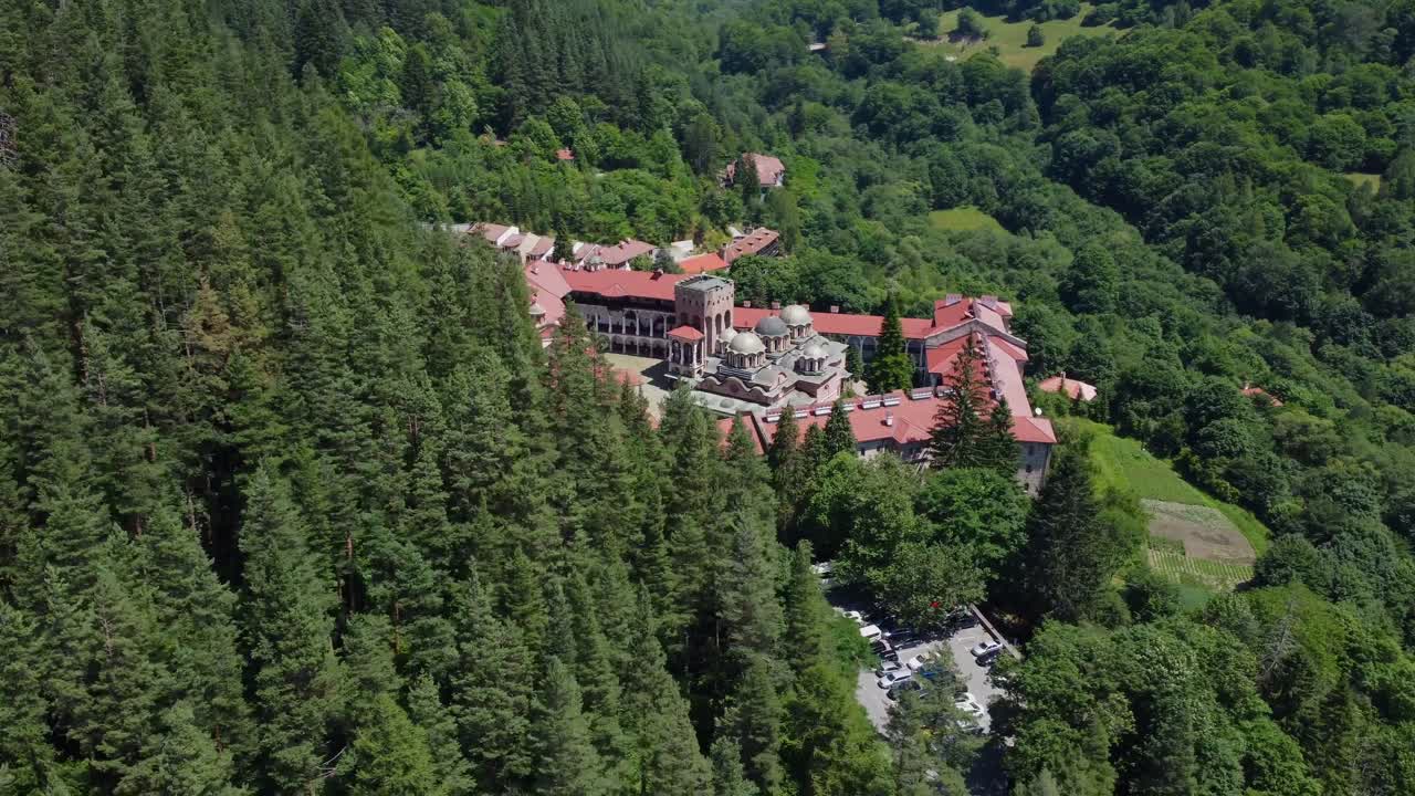 Cinematic drone reveal for Rila Monastery amongst the forests of Rila, Bulgaria