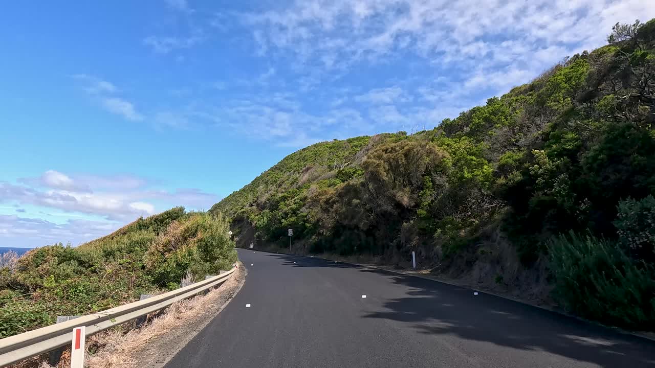 A 45-second video capturing a drive along the picturesque Great Ocean Road with lush greenery and ocean views