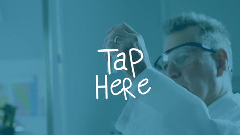 in lab, scientist examining sample with animation text overlaying tap here