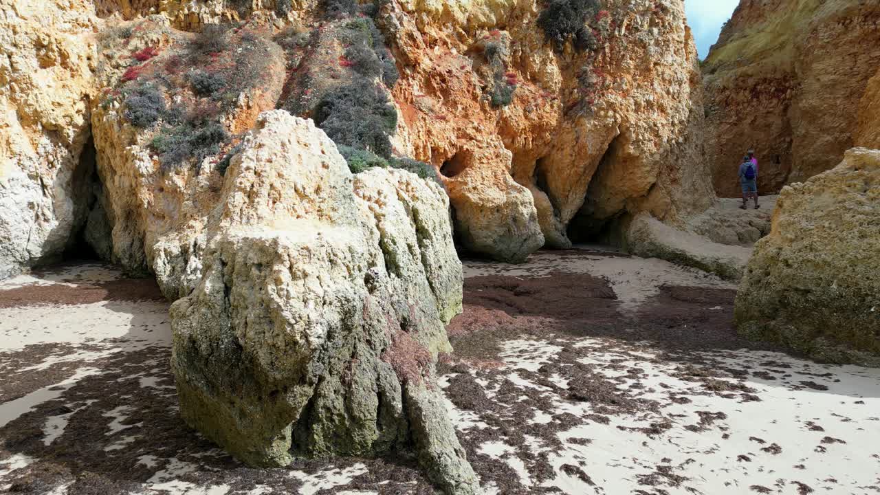Rocks on the shore of a lake visited by tourists, Portugal