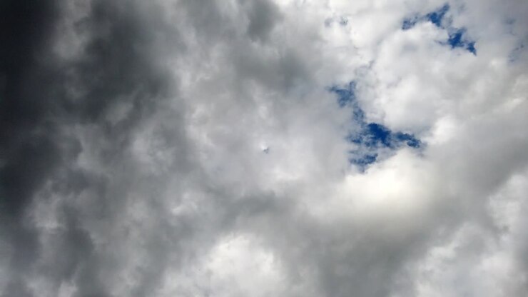 Dark stormy clouds rolling by on a spring morning day, no persons