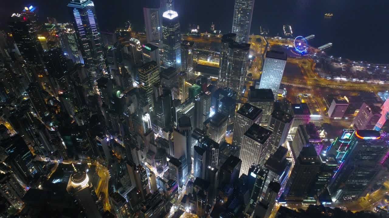 noche iluminada ciudad de hong kong centro de la bahía panorama aéreo 4k china