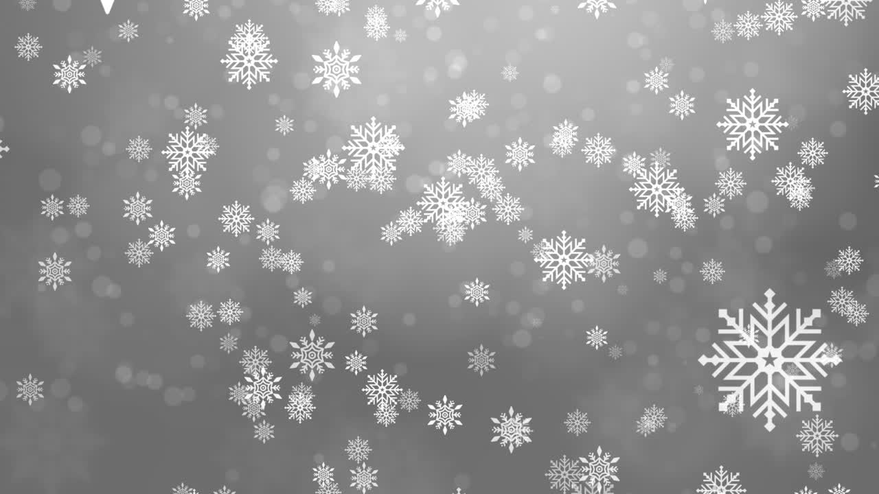 copos de nieve cayendo sobre un fondo gris