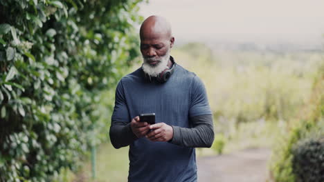 Fitness,-phone-and-a-senior-sports-black-man