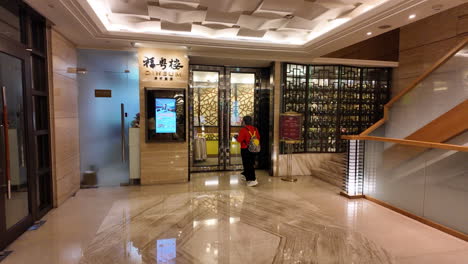 restaurant anticipation: guests taking selfies while awaiting opening