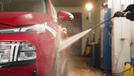 red suv car wash in garage