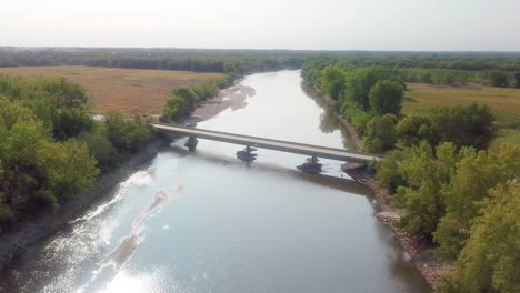 drone aerial view of f62 highway bridge over the iowa river at hills iowa