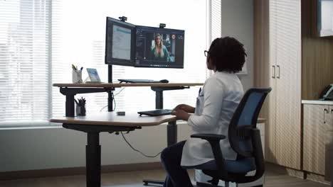 healthcare professional engaged in telemedicine consultation, utilizing technology for patient interaction and remote care management in modern office setting