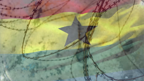 alambre de púas contra la bandera de la república de ghana