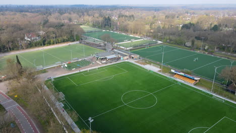 Jib-up-over-large-soccer-fields-at-the-edge-of-a-small-town