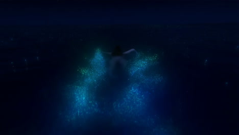 a person swimming amidst glowing bioluminescent particles in dark water