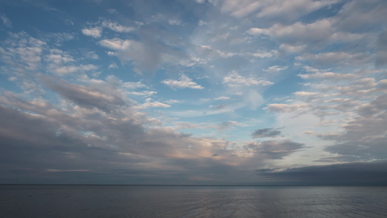Sky and water scene over Lake Ontario at sunset, peaceful and calming mood