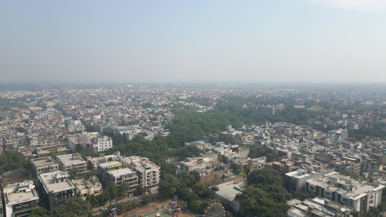 Drone Rise Above Amusement Park And Neighborhoods In New Delhi India 4K 60FPS