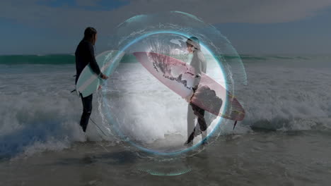 two surfers catching waves on beach, with animated tech overlay showing wave data and weather icons