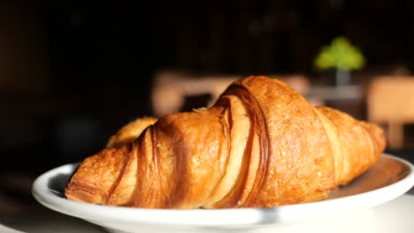 golden croissant on a plate