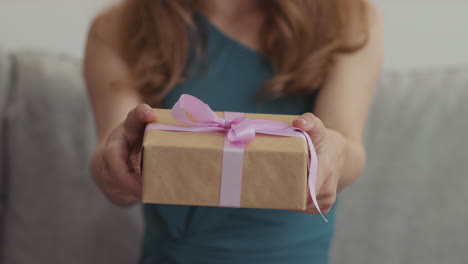 woman giving a gift