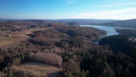 Aerial-forward-view-of-natural-park-of-Polanczyk-with-the-lake