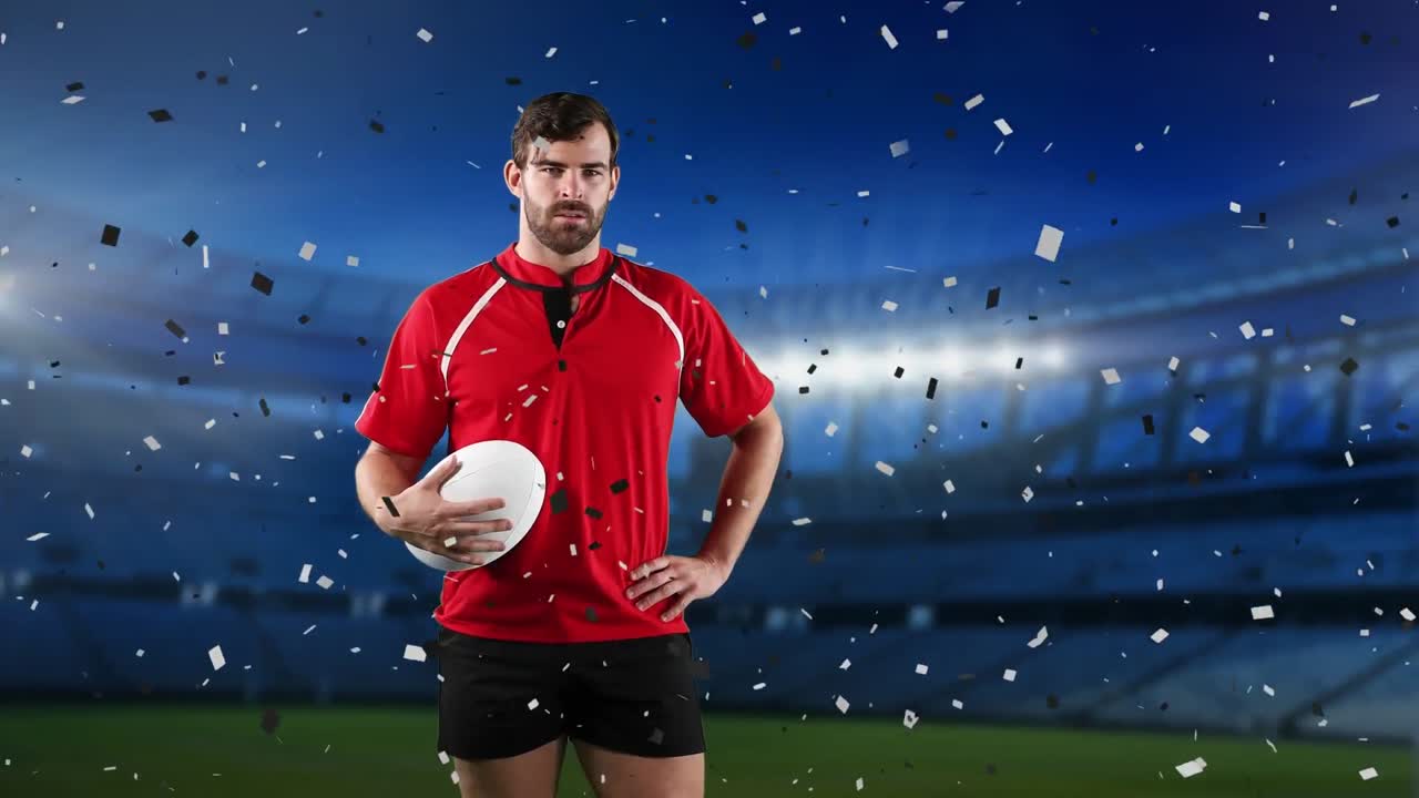 프로 럭비 선수 가 콘페티 가 떨어지는 경기장 앞 에 서 있다
