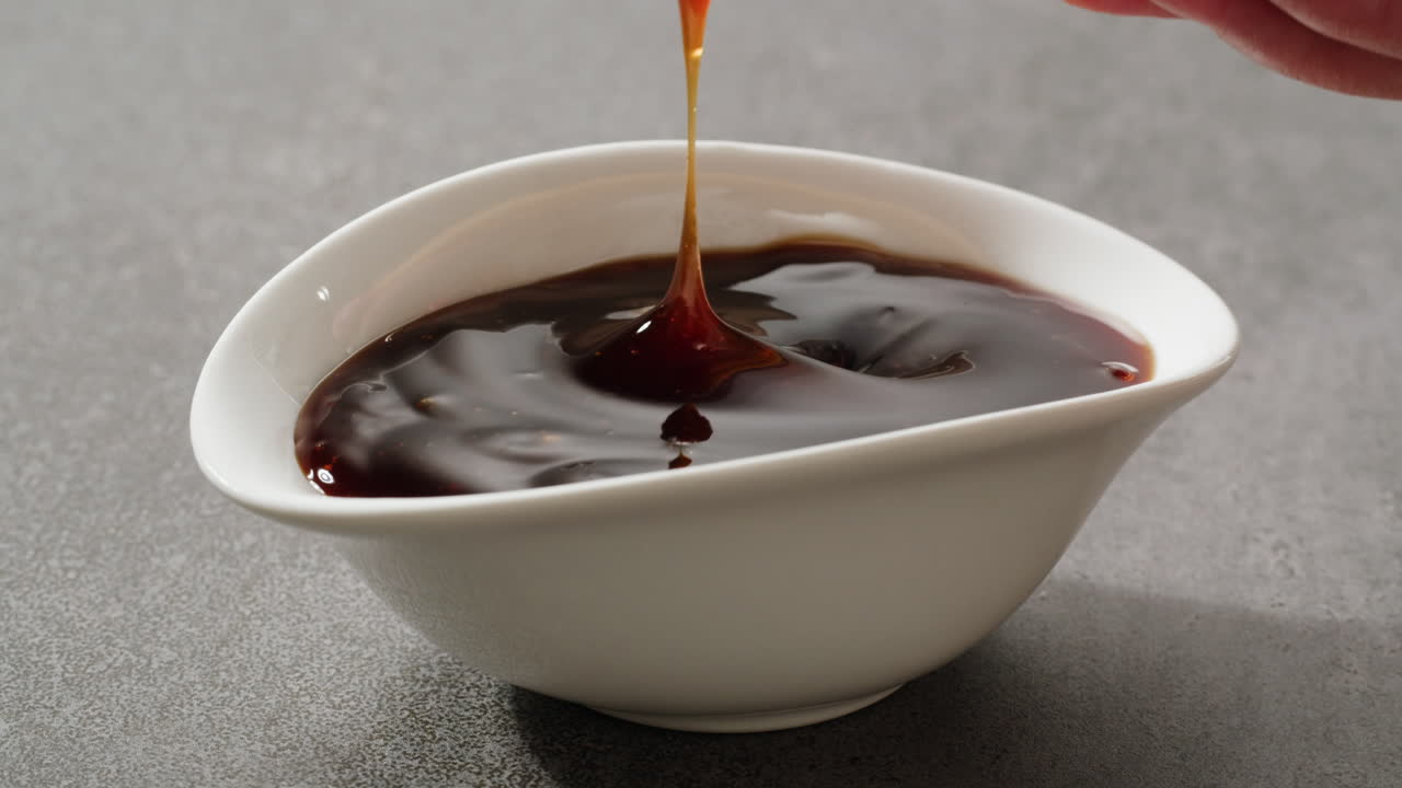 Dipping a Crispy Fried Snack in Sweet and Sour Sauce